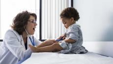 Doctor treating child